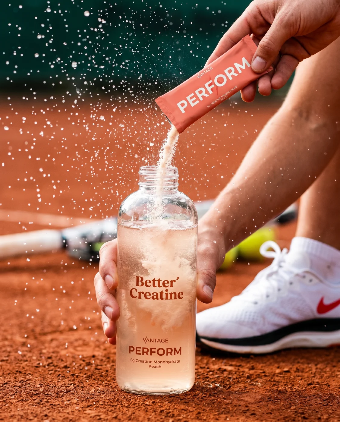 Vantage Perform peach creatine poured into a bottle on the court